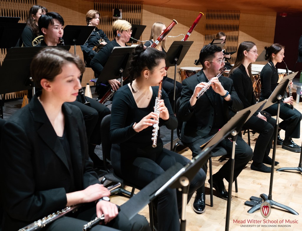 Sydney sitting in a UW Symphony Orchestra performance in 2023.