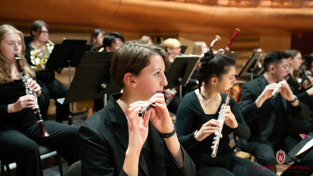 Sydney playing piccolo in the UW-Symphony Orchestra ca. 2023