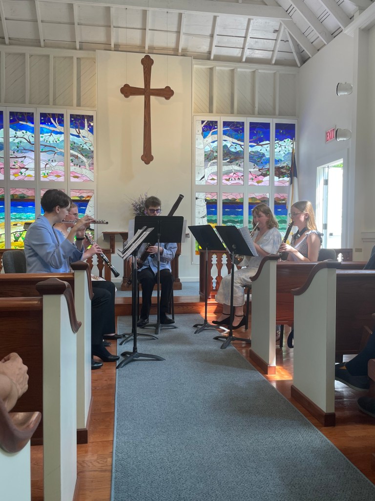 Sydney performing in a wind quintet.